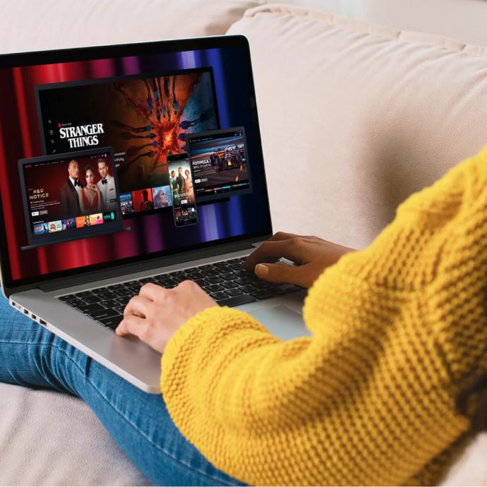 Woman with laptop with Netflix Stranger Things open